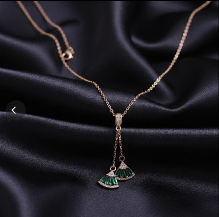Rose gold chain with green crystal charms