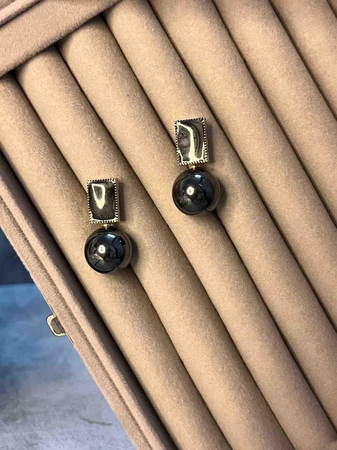 Black ball statement earrings